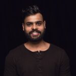 close-up-portrait-young-man-isolated-black-studio-background-photoshot-real-emotions-male-model-smiling-feeling-happy-facial-expression-pure-clear-human-emotions-concept_155003-25751